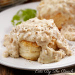 Plate of biscuits topped with creamy sausage gravy