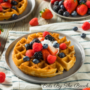 Homemade Belgian waffles with fresh berries and whipped cream