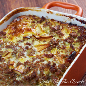 An international recipe for Bobotie. Made with ground beef, curry, raisins, and topped with an egg custard, this is the ultimate comfort food.