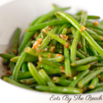 Dish of sauteed haricot verts, a french green bean, in butter and shallots.