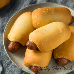 An easy breakfast recipe of sausage and cheese wrapped in a biscuit.