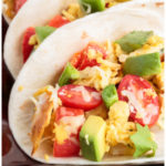 Vegetarian Migas tacos with eggs, onion, jalapeno, fried corn tortilla pieces, and cheese. A Tex-Mex recipe.