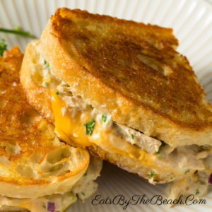 A classic tuna melt sandwich with cheese on buttery sourdough bread. A diner style sandwich that is the perfect comfort food.