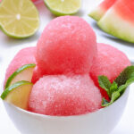 A refreshing dish of watermelon sherbet - a no churn sherbet recipe using fresh watermelon, sweetened condensed milk, lime juice and zest. So easy and refreshing.