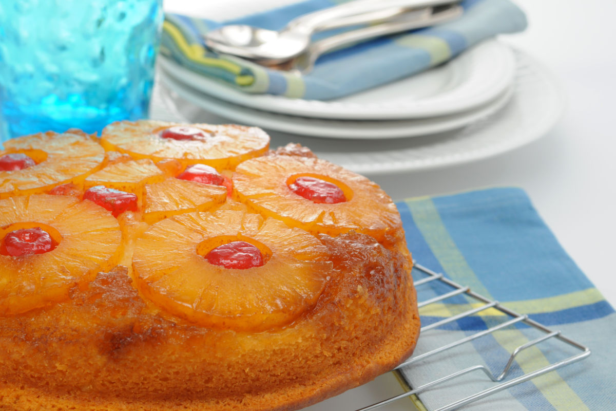 Homemade Pineapple Upside Down Cake cooling on a wire rack.