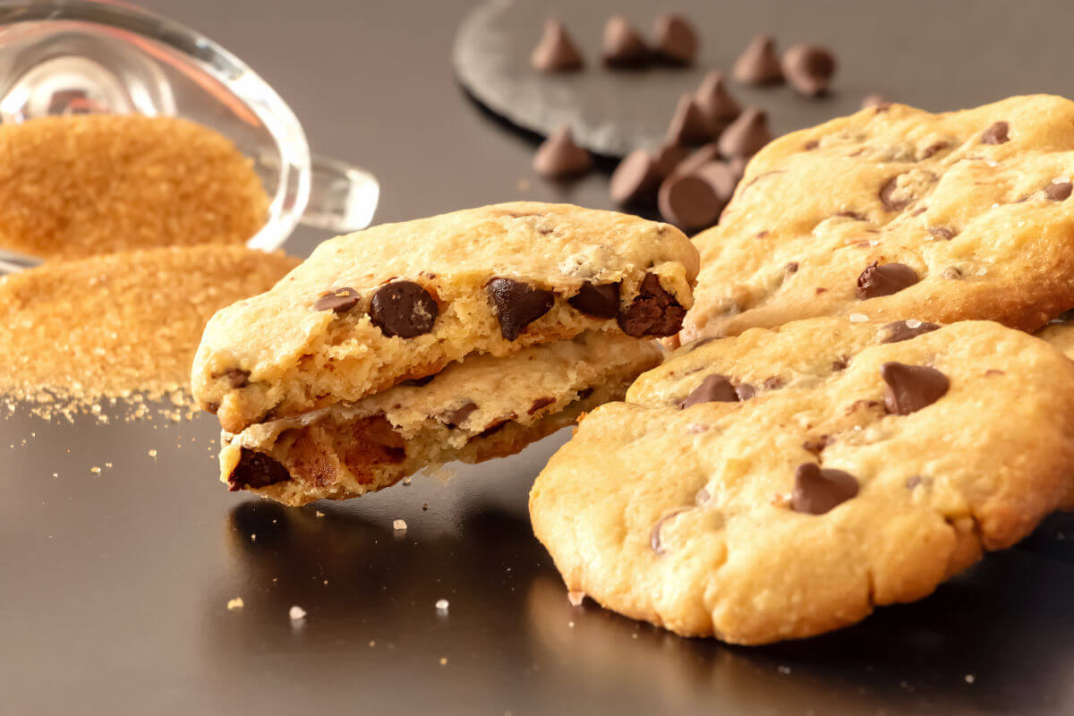 Slate platter of buttery, salted caramel chocolate chip cookies