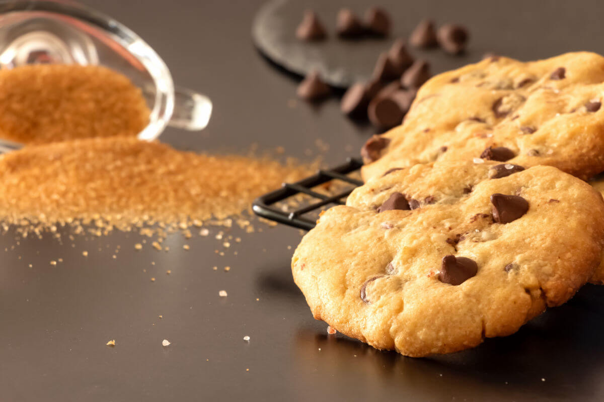 Slate platter of buttery, salted caramel chocolate chip cookies 