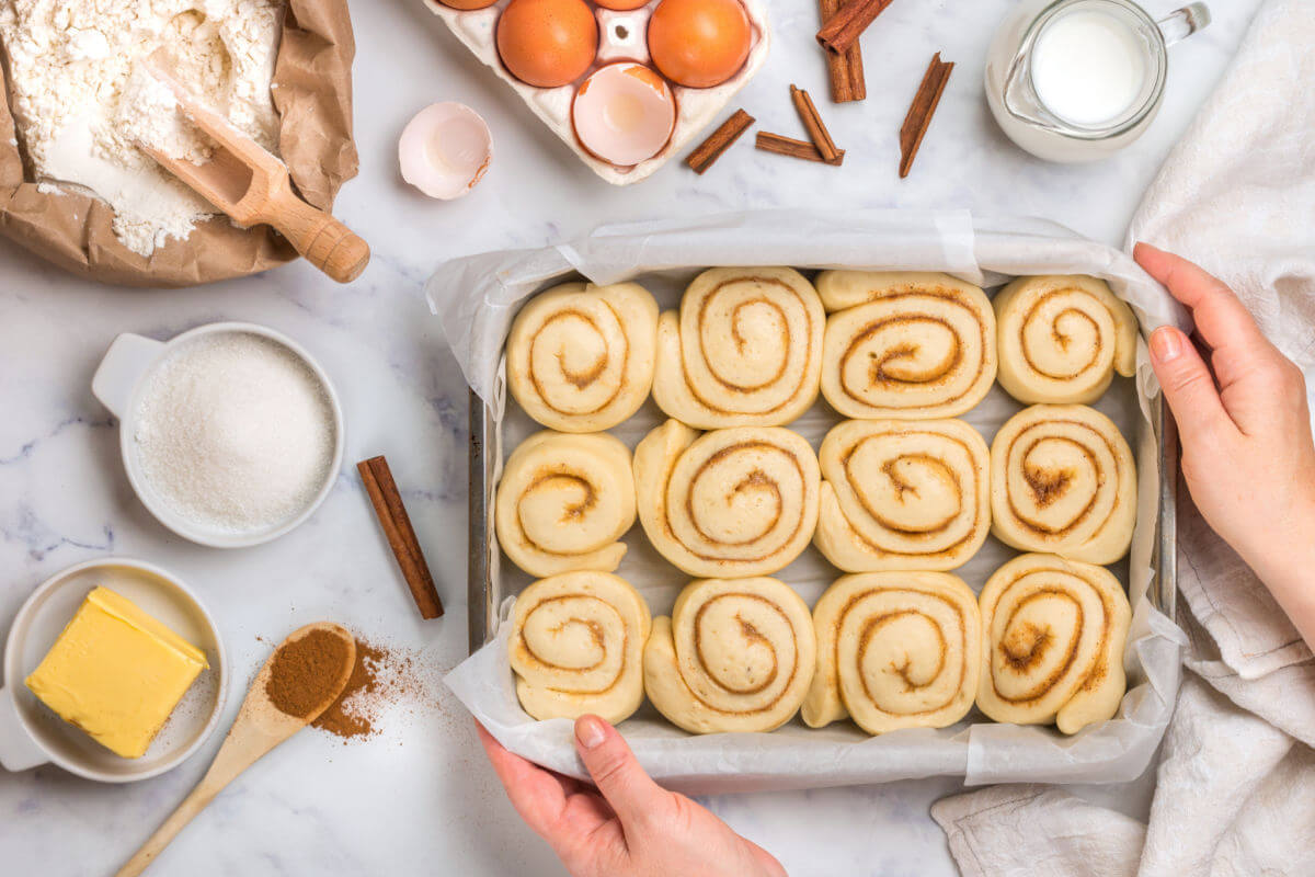 Pan of easy cinnamon rolls to bake with some of the ingredients.