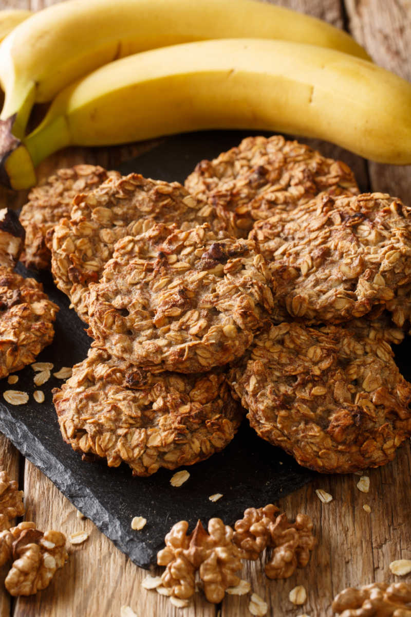 Black platter of homemade, healthy banana walnut breakfast cookies