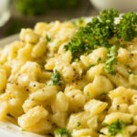 Bowl of homemade Parslied German Spaetzle garnished with chopped parsley.