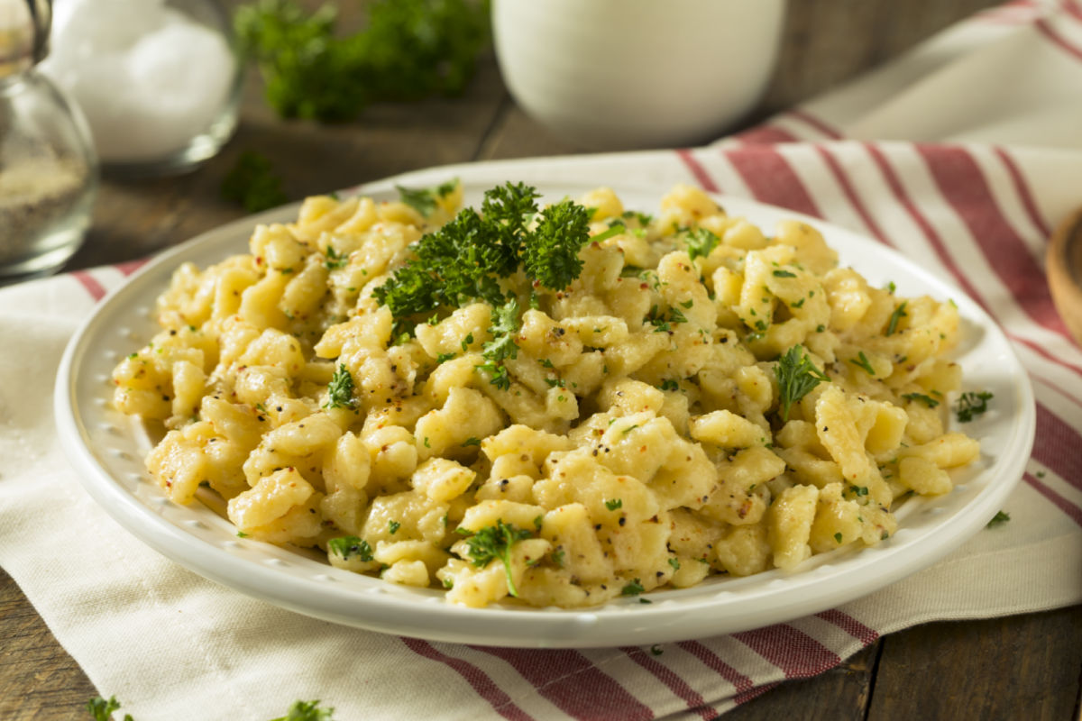 Bowl of homemade Parslied German Spaetzle garnished with chopped parsley.