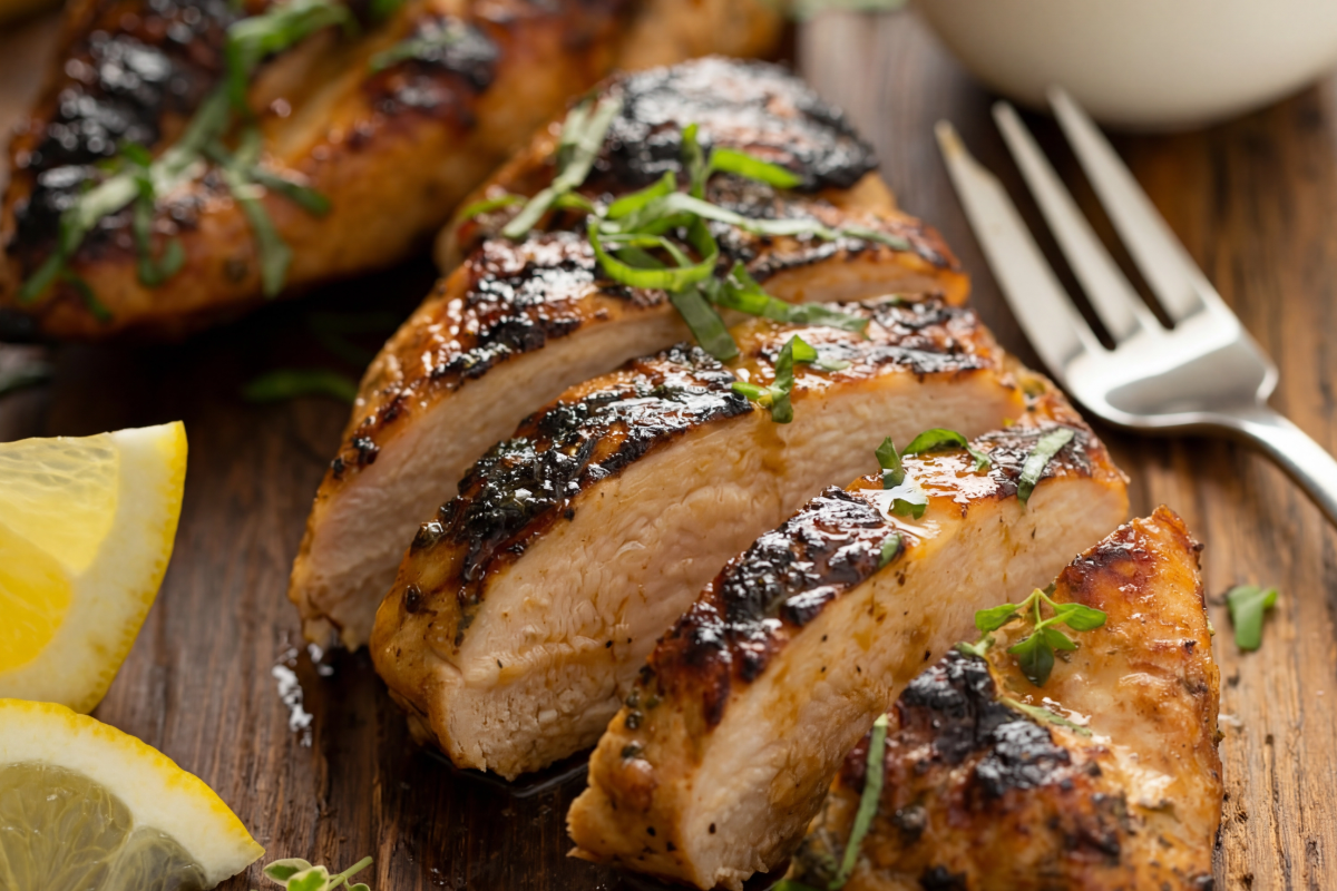 Close up view of sliced, reversed seared chicken breast.